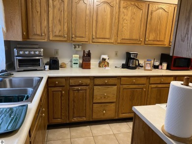 Discover comfort, space, and convenience in this unique on West Branch Country Club in Michigan - for sale on GolfHomes.com, golf home, golf lot