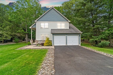 This impeccably maintained 3-bedroom, 4-bathroom contemporary on Country Club of the Poconos Golf Course in Pennsylvania - for sale on GolfHomes.com, golf home, golf lot