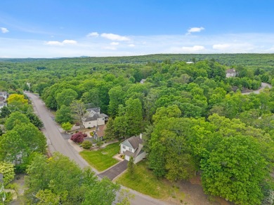 This impeccably maintained 3-bedroom, 4-bathroom contemporary on Country Club of the Poconos Golf Course in Pennsylvania - for sale on GolfHomes.com, golf home, golf lot