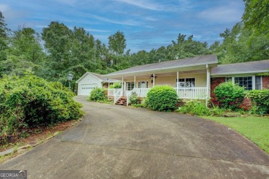 Year-round big water views of Jackson Lake!! This 3-bedroom & 2 on Turtle Cove Golf Course in Georgia - for sale on GolfHomes.com, golf home, golf lot