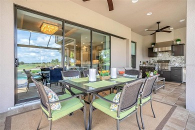 Discover luxurious comfort in this stunning on Esplanade Golf and Country at Lakewood Ranch in Florida - for sale on GolfHomes.com, golf home, golf lot