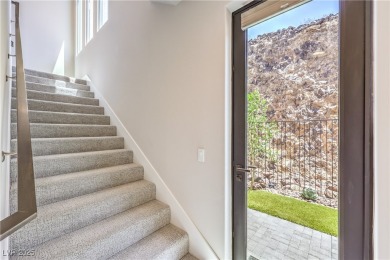 Experience elevated living in this stunning 3-story modern on Dragon Ridge Country Club in Nevada - for sale on GolfHomes.com, golf home, golf lot