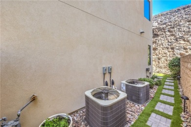 Experience elevated living in this stunning 3-story modern on Dragon Ridge Country Club in Nevada - for sale on GolfHomes.com, golf home, golf lot