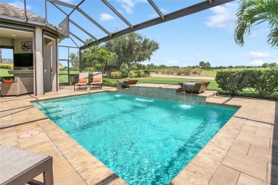 Discover luxurious comfort in this stunning on Esplanade Golf and Country at Lakewood Ranch in Florida - for sale on GolfHomes.com, golf home, golf lot