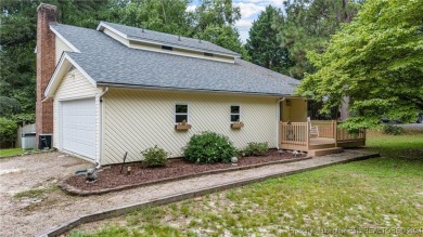 This fully updated home is nestled in a serene lake and golf on Seven Lakes Country Club in North Carolina - for sale on GolfHomes.com, golf home, golf lot