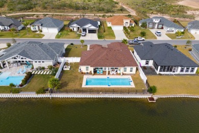 Discover this beautiful 3-bedroom, 2-bathroom lakeside home in on South Padre Island Golf Club in Texas - for sale on GolfHomes.com, golf home, golf lot