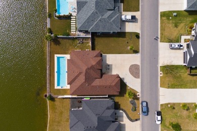 Discover this beautiful 3-bedroom, 2-bathroom lakeside home in on South Padre Island Golf Club in Texas - for sale on GolfHomes.com, golf home, golf lot