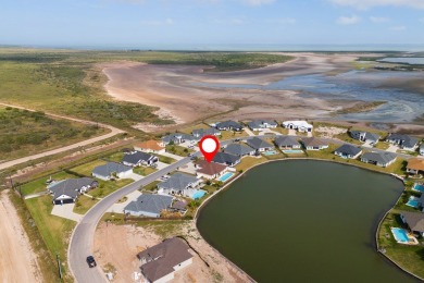 Discover this beautiful 3-bedroom, 2-bathroom lakeside home in on South Padre Island Golf Club in Texas - for sale on GolfHomes.com, golf home, golf lot