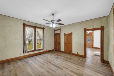 Step inside this spacious 4 bedroom, 2 bath home situated on a on Woodlawn Country Club in Illinois - for sale on GolfHomes.com, golf home, golf lot