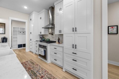 Custom home with high-end finishes and thoughtful design on Bella Vista Country Club - Highlands in Arkansas - for sale on GolfHomes.com, golf home, golf lot