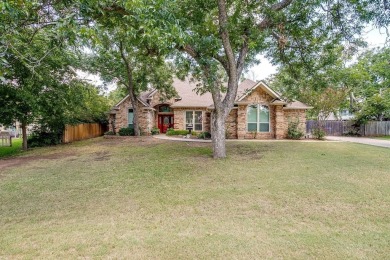 Welcome to this elegant 3-bedroom, 2.5-bath home located in the on Pecan Plantation Country Club in Texas - for sale on GolfHomes.com, golf home, golf lot