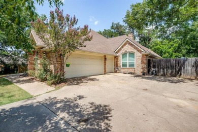 Welcome to this elegant 3-bedroom, 2.5-bath home located in the on Pecan Plantation Country Club in Texas - for sale on GolfHomes.com, golf home, golf lot
