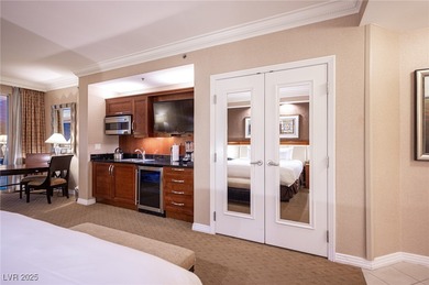 Panoramic Strip View Suite with balcony offering breathtaking on The Wynn Golf Club in Nevada - for sale on GolfHomes.com, golf home, golf lot