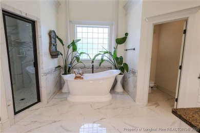 Welcome to this stunning 4 bed, 4 full bath custom home in the on Gates Four Golf and Country Club in North Carolina - for sale on GolfHomes.com, golf home, golf lot