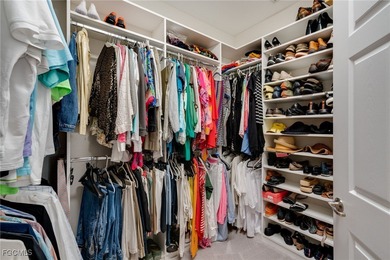 Arrive by PRIVATE ELEVATOR and step into a home that immediately on Pelican Preserve Golf Club in Florida - for sale on GolfHomes.com, golf home, golf lot