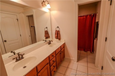 Welcome to this stunning 4 bed, 4 full bath custom home in the on Gates Four Golf and Country Club in North Carolina - for sale on GolfHomes.com, golf home, golf lot