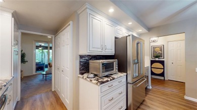 This beautifully upgraded townhome is tucked away in a desirable on Belleview Biltmore Golf Club in Florida - for sale on GolfHomes.com, golf home, golf lot