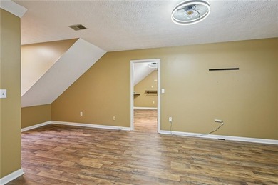 Experience resort-style living every day in this all-brick on Fairfield Plantation Golf and Country Club in Georgia - for sale on GolfHomes.com, golf home, golf lot