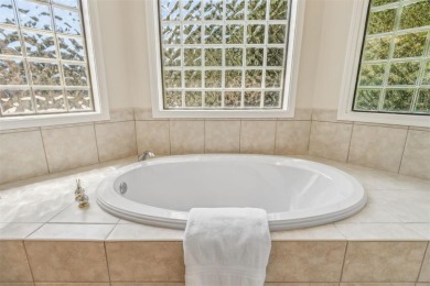 Stunning Amelia National home on a premier lot tucked into a on Amelia National Golf and Country Club in Florida - for sale on GolfHomes.com, golf home, golf lot