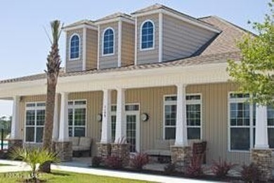 Former Model Home for sale! Welcome to luxury coastal living in on Ocean Ridge Plantation in North Carolina - for sale on GolfHomes.com, golf home, golf lot