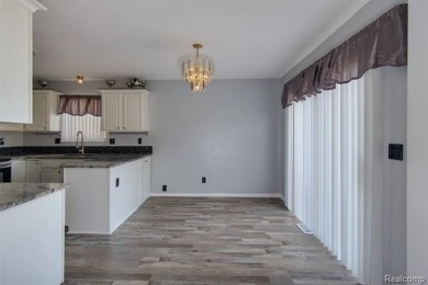 This beautifully updated home on a premium water view lot on Gateway Golf Club in Michigan - for sale on GolfHomes.com, golf home, golf lot