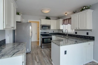 This beautifully updated home on a premium water view lot on Gateway Golf Club in Michigan - for sale on GolfHomes.com, golf home, golf lot
