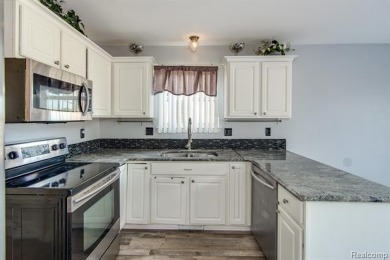 This beautifully updated home on a premium water view lot on Gateway Golf Club in Michigan - for sale on GolfHomes.com, golf home, golf lot