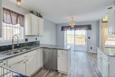 This beautifully updated home on a premium water view lot on Gateway Golf Club in Michigan - for sale on GolfHomes.com, golf home, golf lot