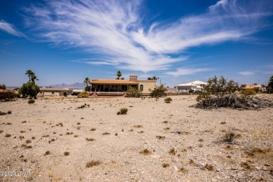 This remarkable corner lot boasts a captivating view of a on London Bridge Golf Course in Arizona - for sale on GolfHomes.com, golf home, golf lot