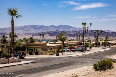 This remarkable corner lot boasts a captivating view of a on London Bridge Golf Course in Arizona - for sale on GolfHomes.com, golf home, golf lot