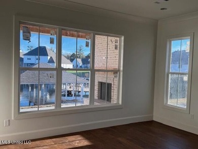 Waterfront - Boathouse - Two Boat Slips - Resort-Style Living on Lake Caroline Golf Club in Mississippi - for sale on GolfHomes.com, golf home, golf lot