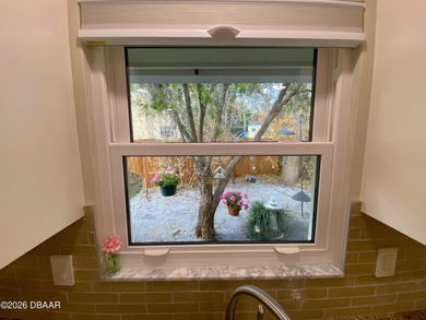 This beautiful home boasts a newer December 2024 roof and is in on Tomoka Oaks Golf and Country Club in Florida - for sale on GolfHomes.com, golf home, golf lot