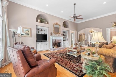 This exquisite four-sided blush brick estate is the epitome of on Royal Lakes Golf and Country Club in Georgia - for sale on GolfHomes.com, golf home, golf lot