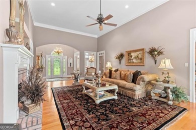 This exquisite four-sided blush brick estate is the epitome of on Royal Lakes Golf and Country Club in Georgia - for sale on GolfHomes.com, golf home, golf lot