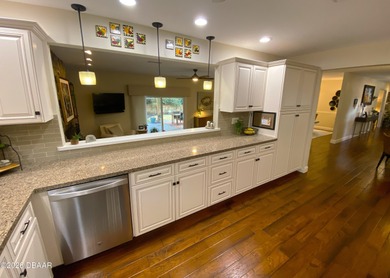 This beautiful home boasts a newer December 2024 roof and is in on Tomoka Oaks Golf and Country Club in Florida - for sale on GolfHomes.com, golf home, golf lot