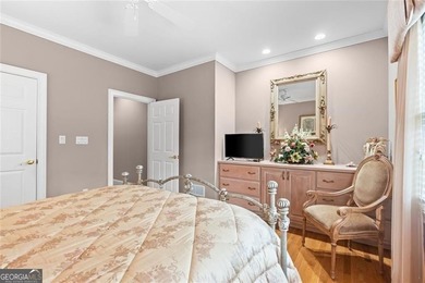 This exquisite four-sided blush brick estate is the epitome of on Royal Lakes Golf and Country Club in Georgia - for sale on GolfHomes.com, golf home, golf lot