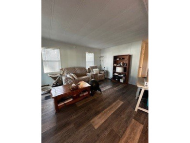 *This home is located in a 55+ resort style leased land on Rolling Greens Executive Golf Community in Florida - for sale on GolfHomes.com, golf home, golf lot