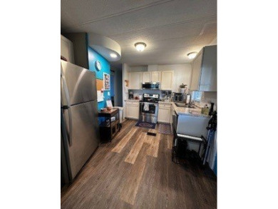 *This home is located in a 55+ resort style leased land on Rolling Greens Executive Golf Community in Florida - for sale on GolfHomes.com, golf home, golf lot