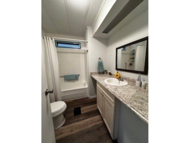 *This home is located in a 55+ resort style leased land on Rolling Greens Executive Golf Community in Florida - for sale on GolfHomes.com, golf home, golf lot