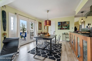Experience waterfront living at its finest at 5802 E Yacht Drive on Founders Club At St. James Plantation in North Carolina - for sale on GolfHomes.com, golf home, golf lot