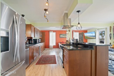 Experience waterfront living at its finest at 5802 E Yacht Drive on Founders Club At St. James Plantation in North Carolina - for sale on GolfHomes.com, golf home, golf lot