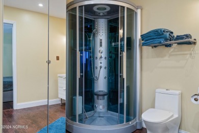 Experience waterfront living at its finest at 5802 E Yacht Drive on Founders Club At St. James Plantation in North Carolina - for sale on GolfHomes.com, golf home, golf lot