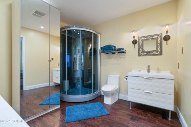 Experience waterfront living at its finest at 5802 E Yacht Drive on Founders Club At St. James Plantation in North Carolina - for sale on GolfHomes.com, golf home, golf lot