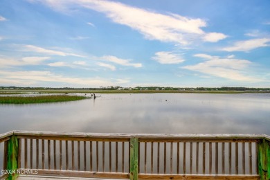 Experience waterfront living at its finest at 5802 E Yacht Drive on Founders Club At St. James Plantation in North Carolina - for sale on GolfHomes.com, golf home, golf lot