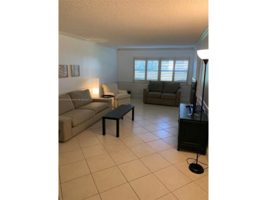 Beautiful first floor end unit. 3 beds, 2 baths with a view to on Wynmoor Golf Course in Florida - for sale on GolfHomes.com, golf home, golf lot