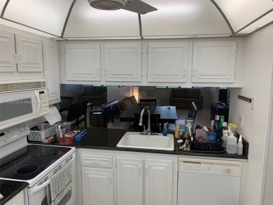 Beautiful first floor end unit. 3 beds, 2 baths with a view to on Wynmoor Golf Course in Florida - for sale on GolfHomes.com, golf home, golf lot