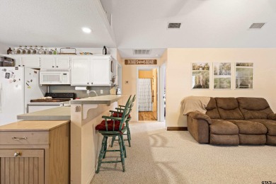 Enjoy this darling 2 bedroom & 2 bath home on two lots with two on Holly Lake Ranch Golf Club in Texas - for sale on GolfHomes.com, golf home, golf lot