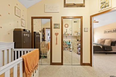 Enjoy this darling 2 bedroom & 2 bath home on two lots with two on Holly Lake Ranch Golf Club in Texas - for sale on GolfHomes.com, golf home, golf lot