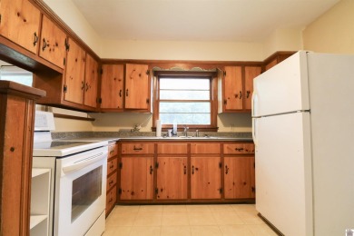 This charming 3-bedroom, 1-bathroom home offers incredible on Rolling Hills Country Club in Kentucky - for sale on GolfHomes.com, golf home, golf lot