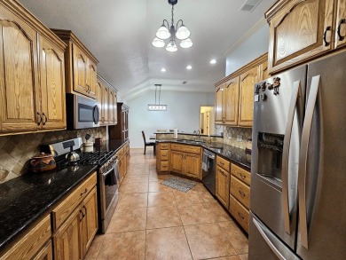 Beautiful 4-bed, 2-bath home just steps from the Andrews County on Andrews County Golf Course in Texas - for sale on GolfHomes.com, golf home, golf lot